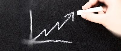 Chalk up arrow on a chalkboard