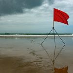 Red flag on beach.