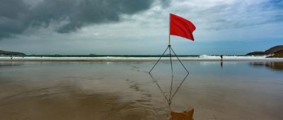 Red flag on beach.