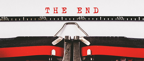 Typewriter with the words The End written in red ink
