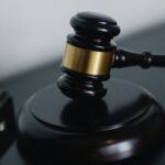 A Brisbane practitioner has faced court over multiple charges relating to misuse of client funds and unlicensed trading.